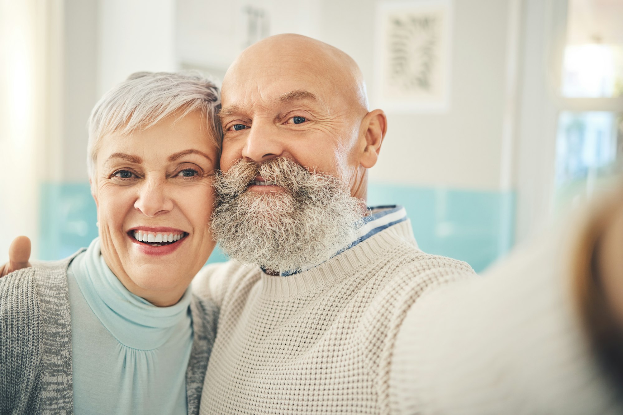 Selfie, love and a senior couple in their home together, posing for a social media profile picture